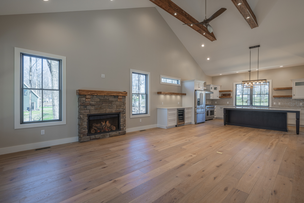 Great room with stone fireplace and vaulted ceiling