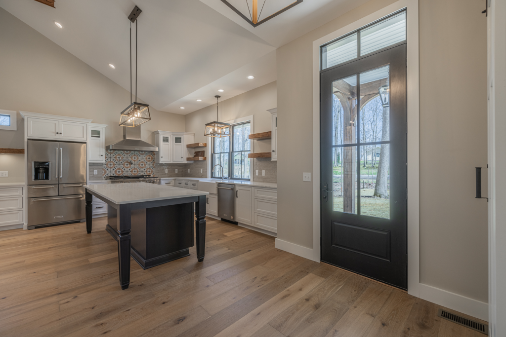 Kitchen and entry with black-framed glass door