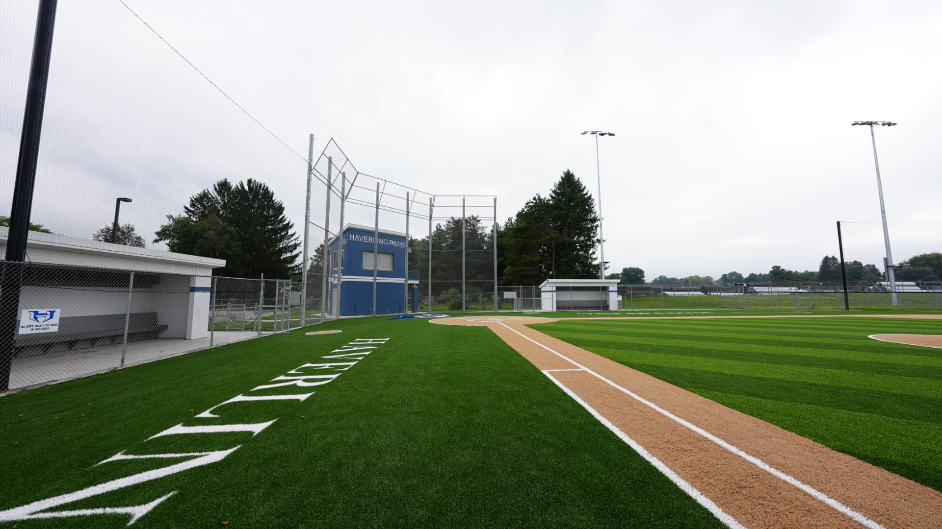 Haverling varsity baseball field with spectator bleachers and dugout